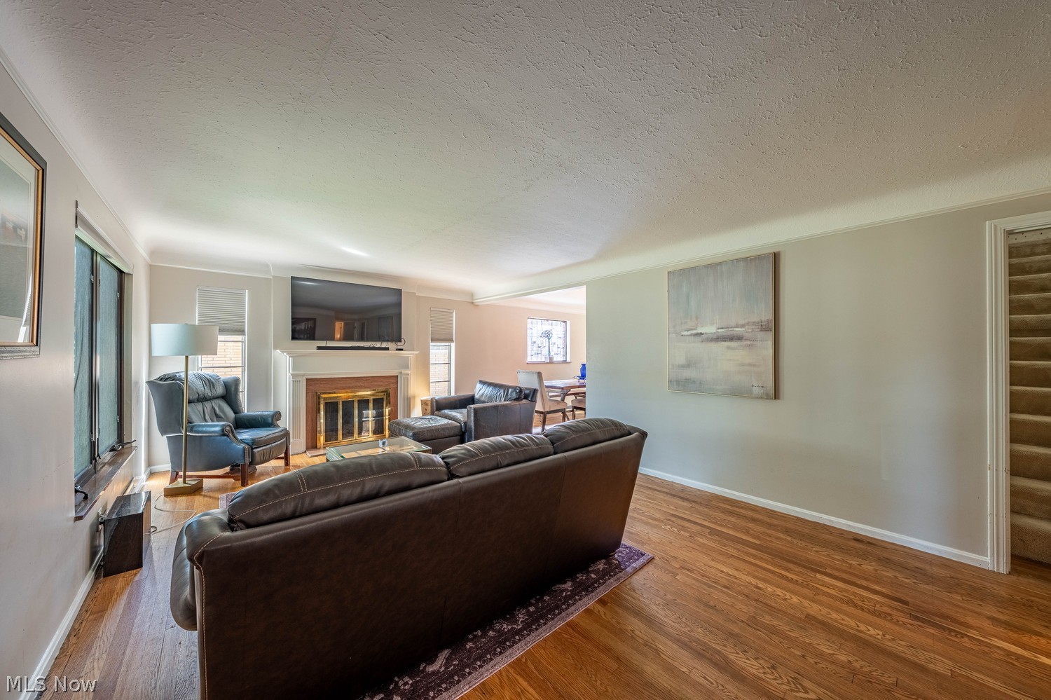 19675 Henry Road Cleveland, OH 44126 - Photo 2 of 42 Spacious living room featuring hardwood floors and a gas log fireplace