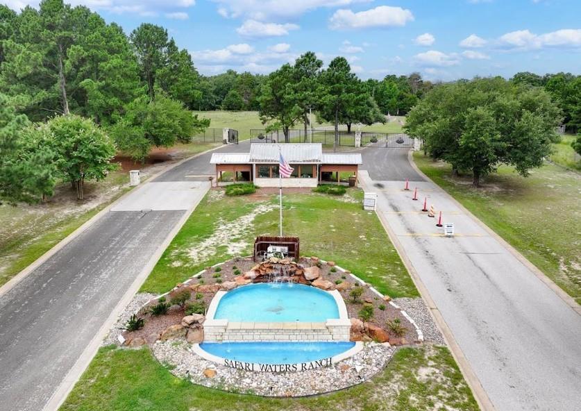 a view of a swimming pool with a yard