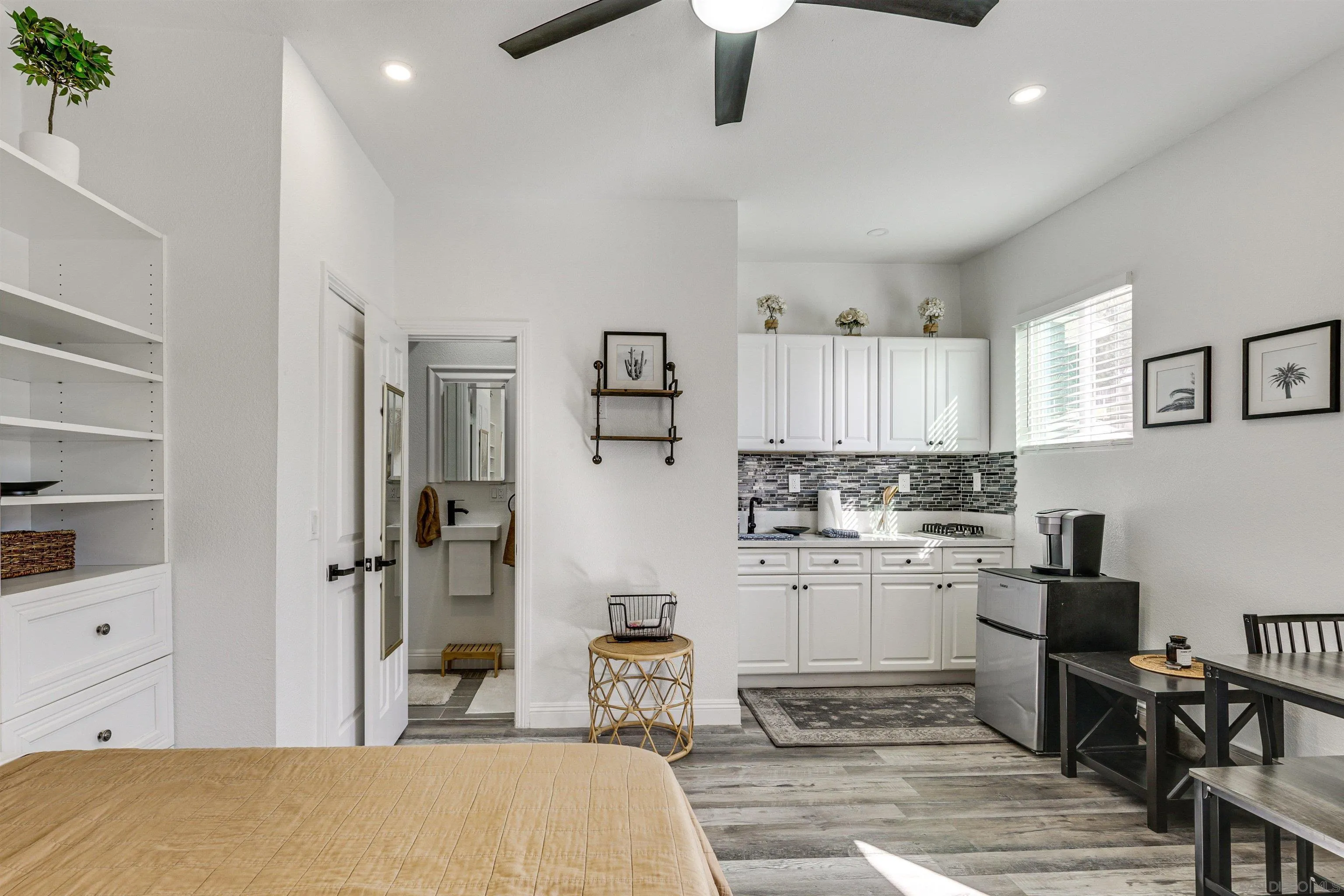 5595 Sweetwater Road Bonita, CA 91902 - Photo 2 of 15 a kitchen with a white cabinets and chairs