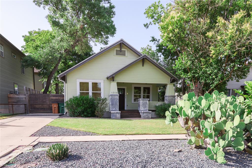 1314 Bob Harrison Street, Unit A Austin, TX 78702 - Photo 1 of 1 a front view of a house with garden