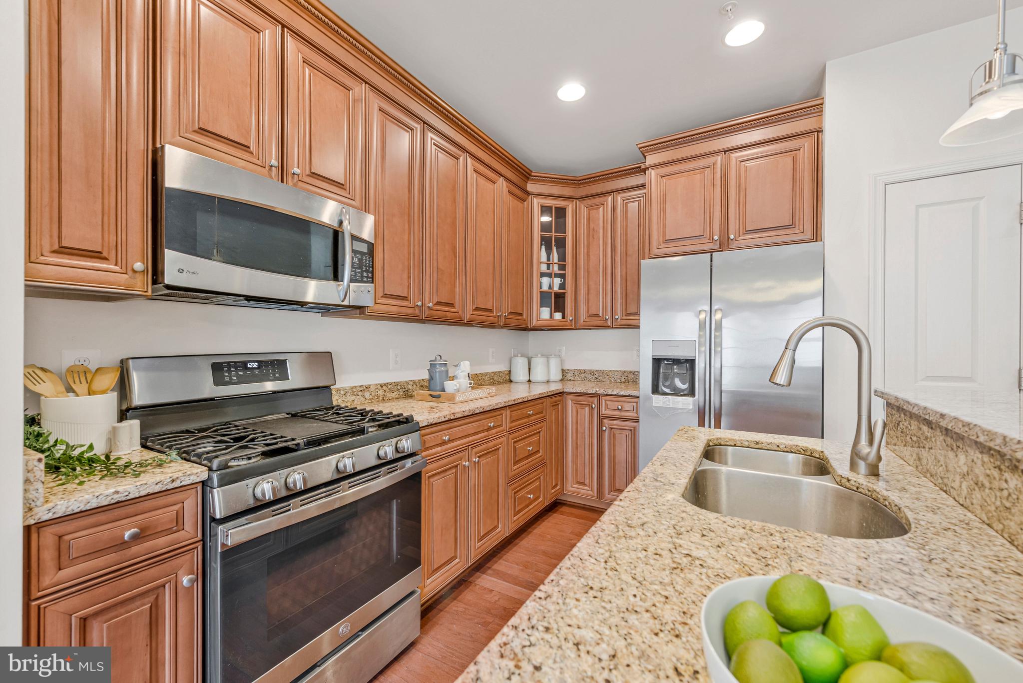32 Boucher Place Annapolis, MD 21403 - Photo 11 of 72 a kitchen with stainless steel appliances granite countertop a sink a stove cabinets and a kitchen island