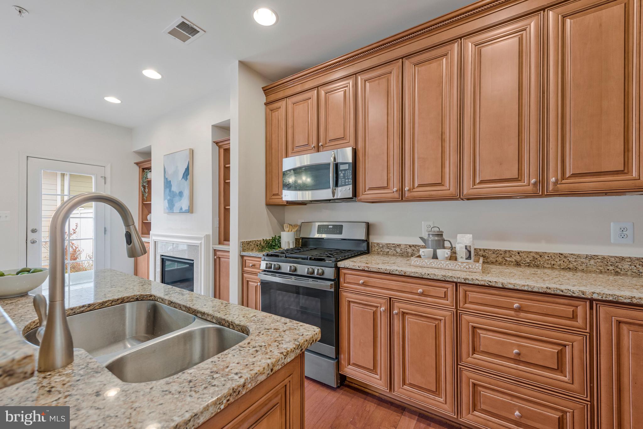32 Boucher Place Annapolis, MD 21403 - Photo 12 of 72 a kitchen with granite countertop a sink stainless steel appliances and cabinets