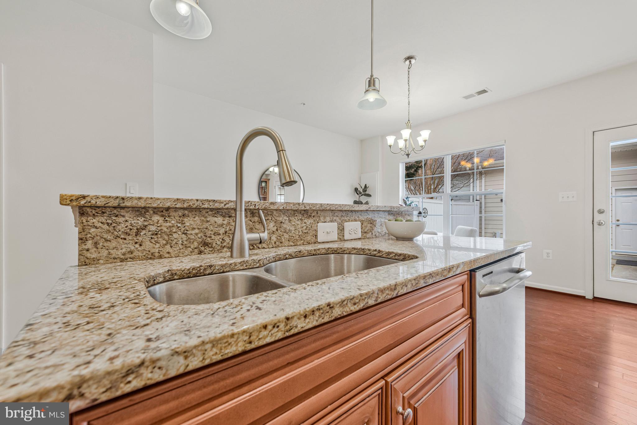 32 Boucher Place Annapolis, MD 21403 - Photo 15 of 72 a kitchen with a sink and chandelier