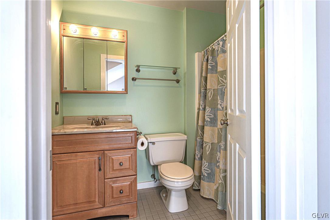 364 Biondo Court Bethlehem, PA 18017 - Photo 15 of 19 a bathroom with a toilet a sink and a mirror