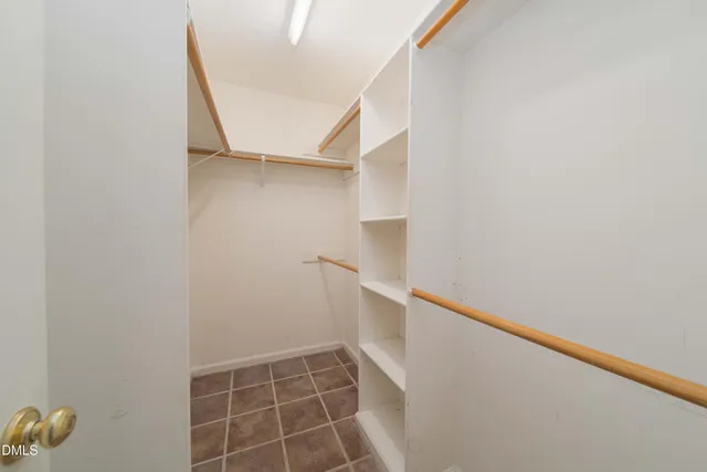 a view of an empty walk in closet