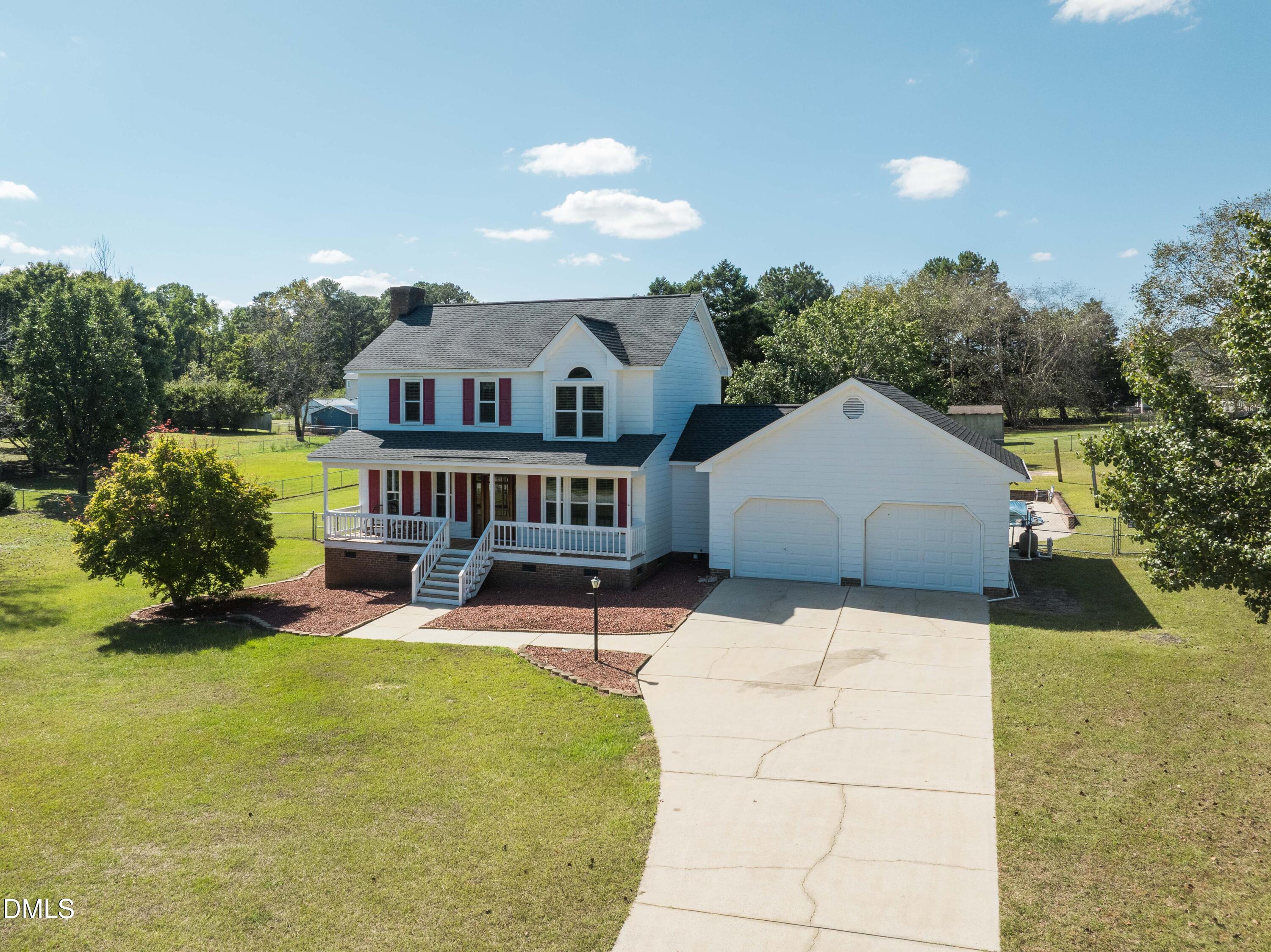 3002 Red Circle Willow Spring, NC 27592 - Photo 2 of 27 a house view with a seating space and garden