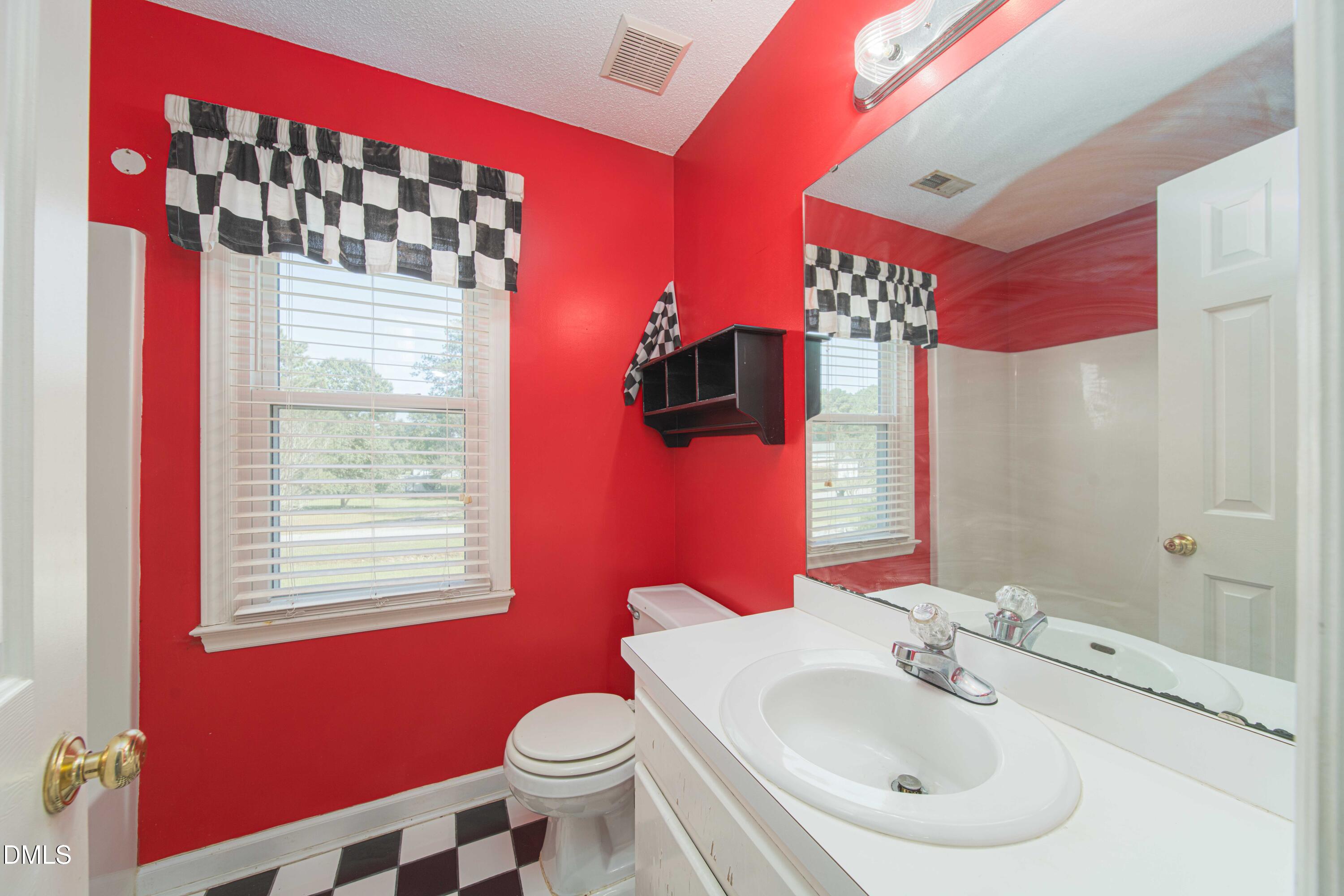 3002 Red Circle Willow Spring, NC 27592 - Photo 21 of 27 a bathroom with a sink toilet and shower
