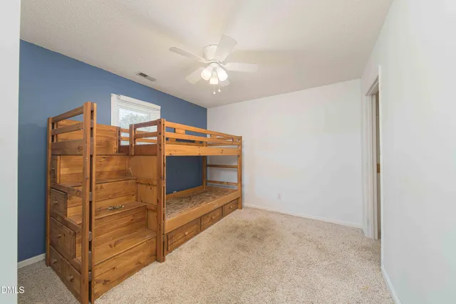 a room with window and ceiling fan