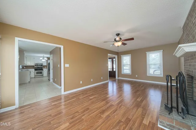 a view of livingroom and kitchen with wooden floor