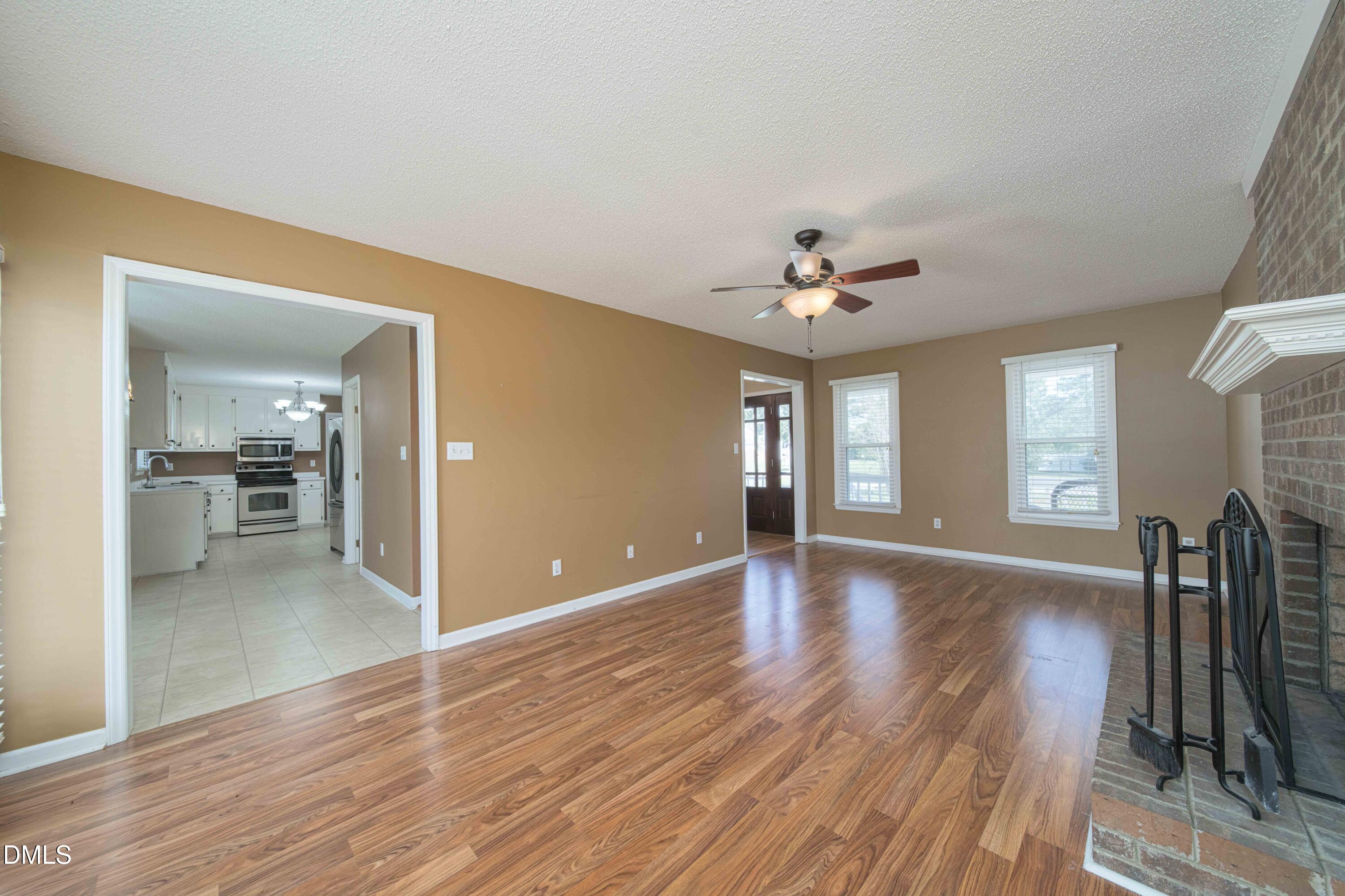 3002 Red Circle Willow Spring, NC 27592 - Photo 7 of 27 a view of livingroom and kitchen with wooden floor