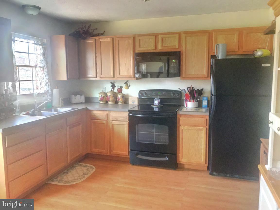 509 Grassdale Street Ranson, WV 25438 - Photo 14 of 28 Nice black appliances hi light wall of cabinetry!
