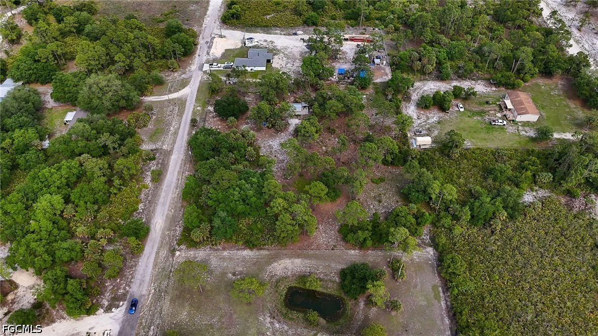 7789 23rd Terrace LaBelle, FL 33935 - Photo 12 of 21 an aerial view of residential house with outdoor space and trees all around