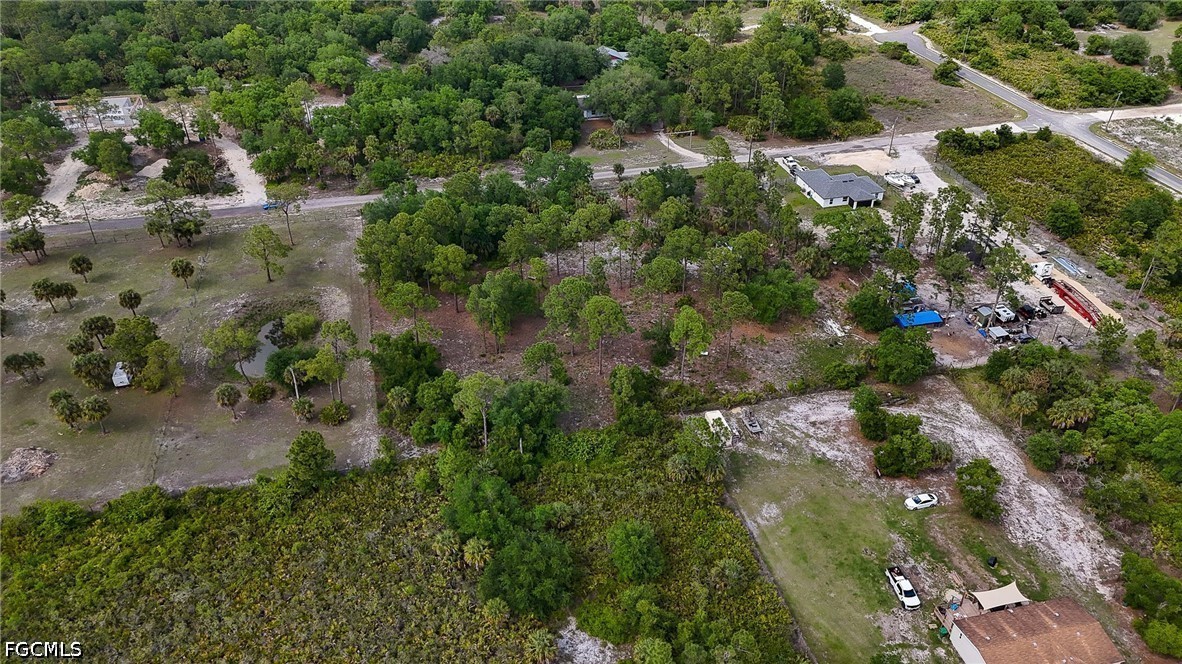 7789 23rd Terrace LaBelle, FL 33935 - Photo 14 of 21 an aerial view of residential houses with outdoor space and trees
