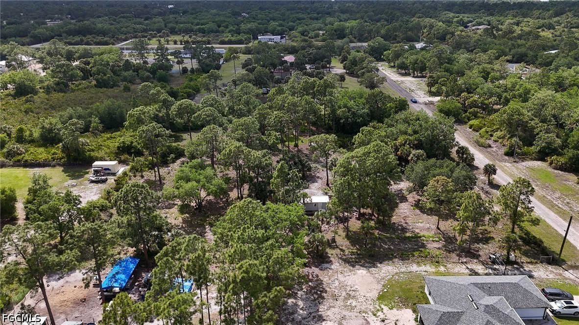 7789 23rd Terrace LaBelle, FL 33935 - Photo 17 of 21 an aerial view of residential house with outdoor space and trees all around