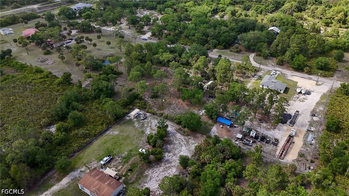 7789 23rd Terrace LaBelle, FL 33935 - Photo 19 of 21 an aerial view of residential house with outdoor space and trees all around