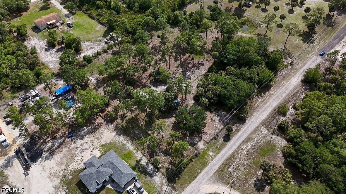 7789 23rd Terrace LaBelle, FL 33935 - Photo 3 of 21 an aerial view of residential house with outdoor space and trees all around