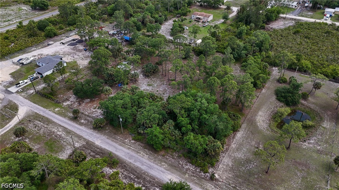 7789 23rd Terrace LaBelle, FL 33935 - Photo 4 of 21 an aerial view of residential house with outdoor space and trees all around