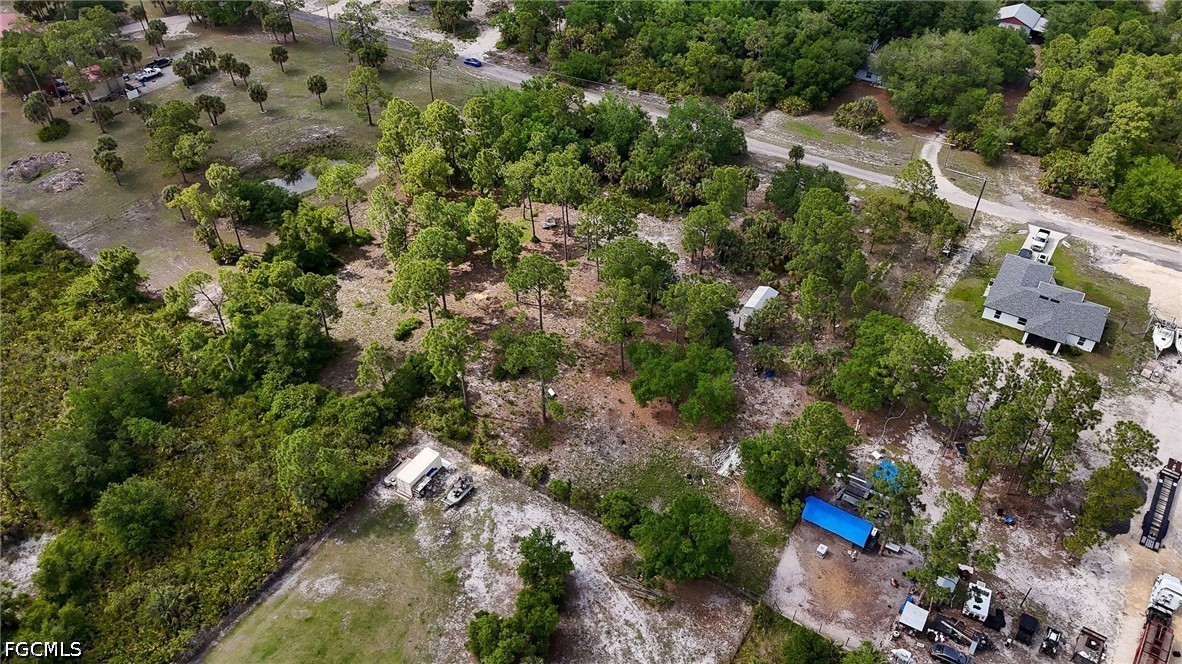 7789 23rd Terrace LaBelle, FL 33935 - Photo 8 of 21 an aerial view of residential house with outdoor space and trees around