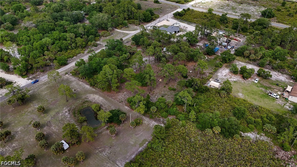 7789 23rd Terrace LaBelle, FL 33935 - Photo 9 of 21 an aerial view of residential houses with outdoor space and trees
