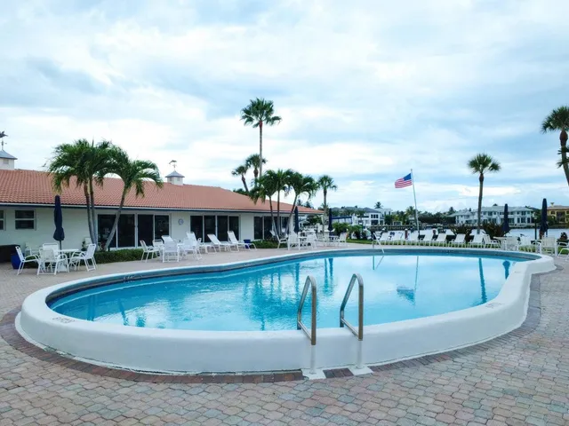 a view of a swimming pool with a patio