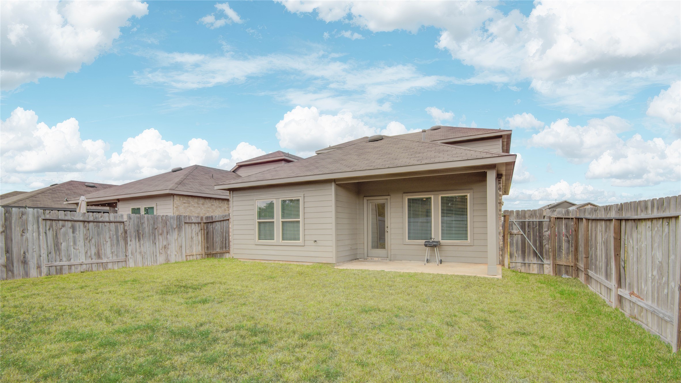 22503 Aspen Tarn Trail Spring, TX 77373 - Photo 24 of 28 Rear view of the home with covered patio for outdoor enjoyment.