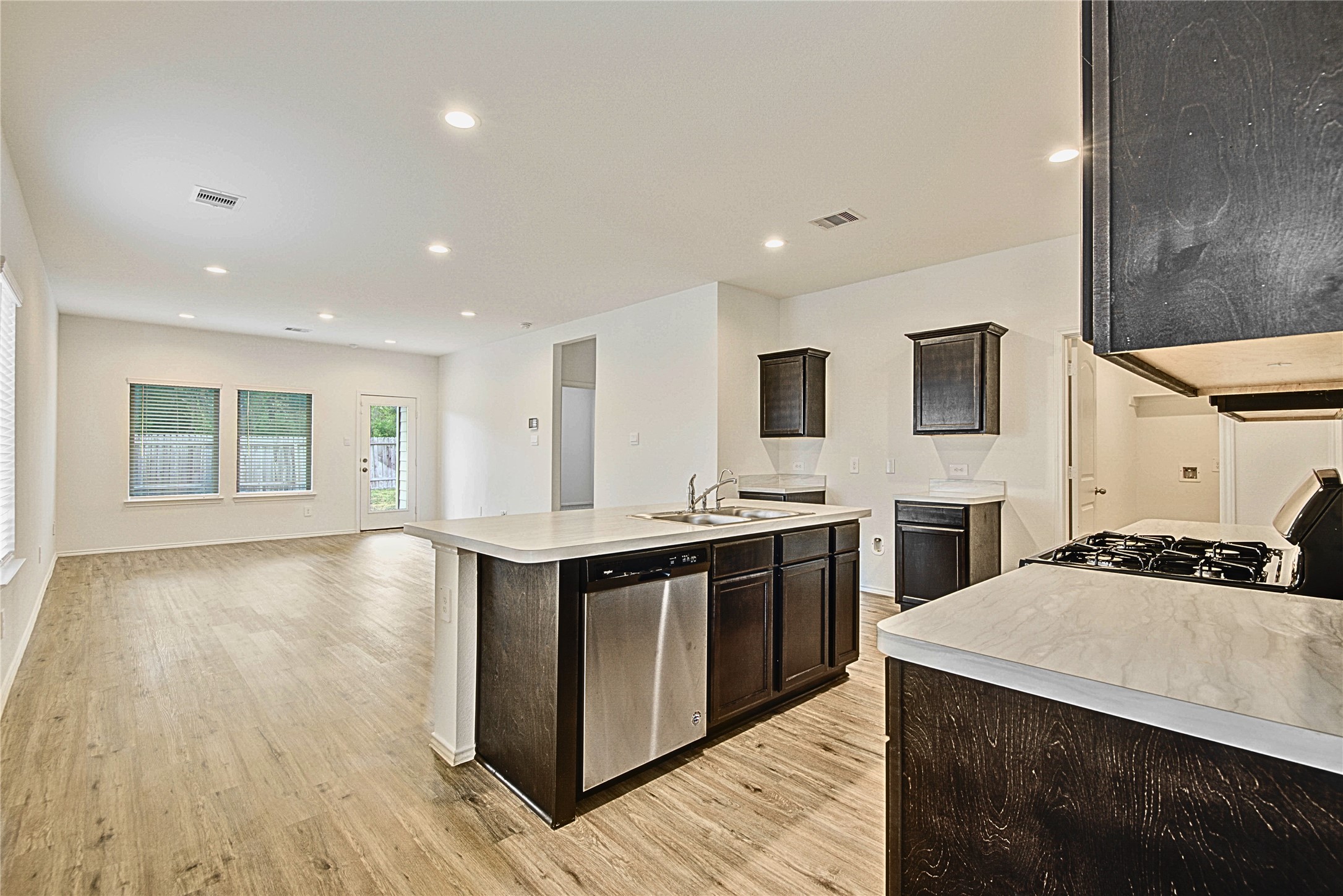 22503 Aspen Tarn Trail Spring, TX 77373 - Photo 5 of 28 Open-concept design connecting kitchen, dining, and living areas.