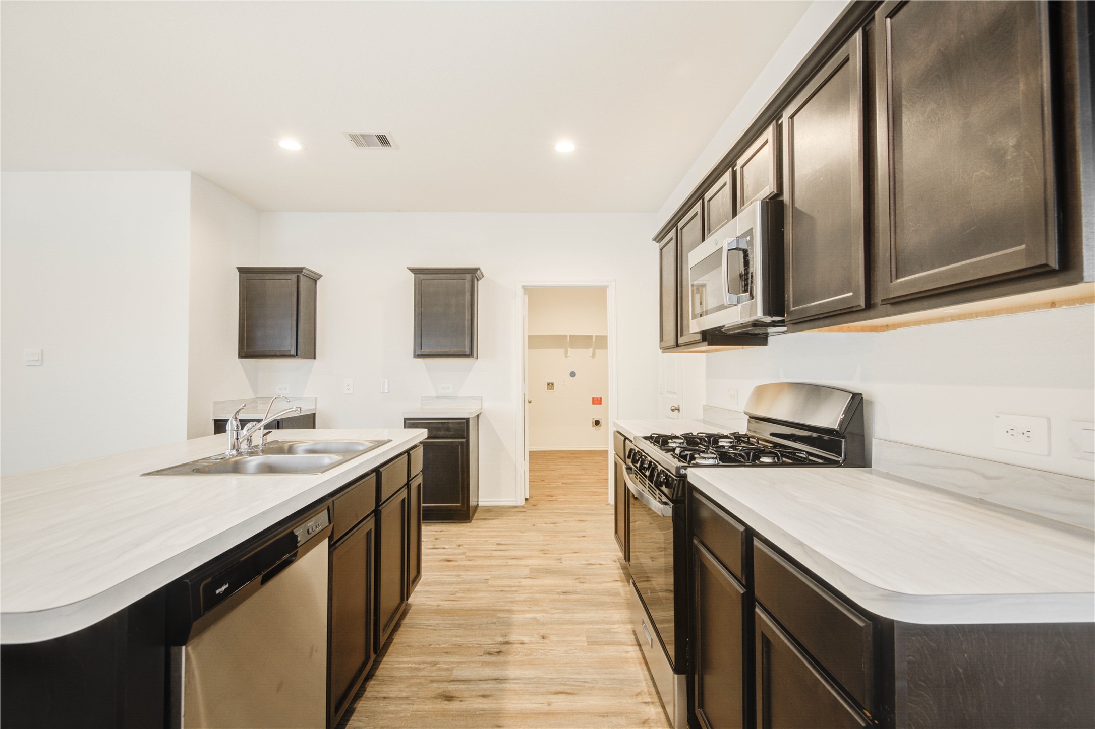 22503 Aspen Tarn Trail Spring, TX 77373 - Photo 6 of 28 Spacious kitchen with rich cabinetry and stainless steel appliances.