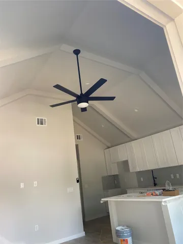 a room with water heater and a wooden cabinets