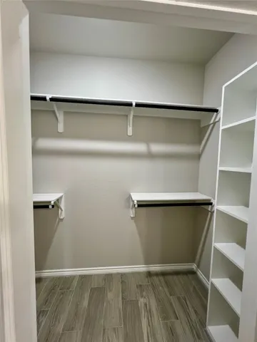 a view of an empty walk in closet