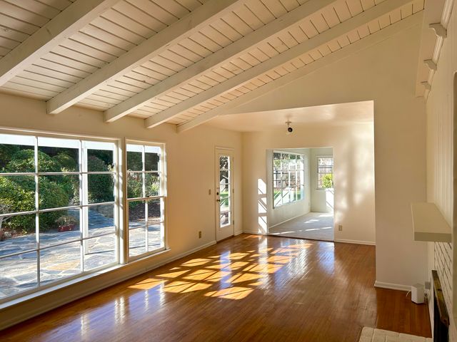 a view of a livingroom with wooden floor
