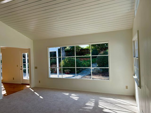 a view of a room with windows and a window