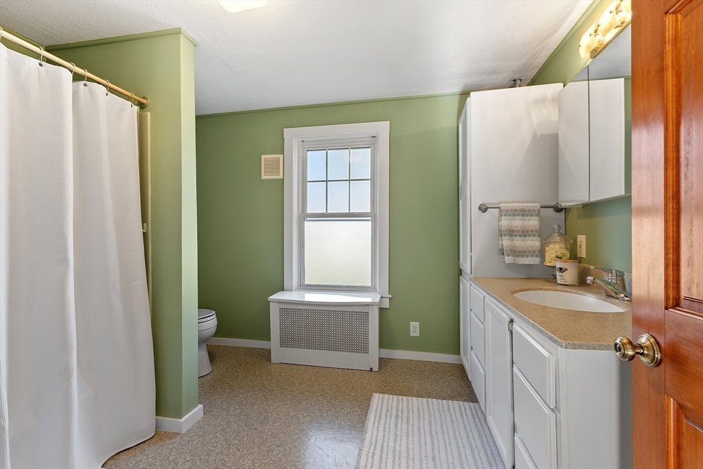 7 Groton-Harvard Road Ayer, MA 01432 - Photo 12 of 35 a bathroom with a sink a toilet and a bathtub