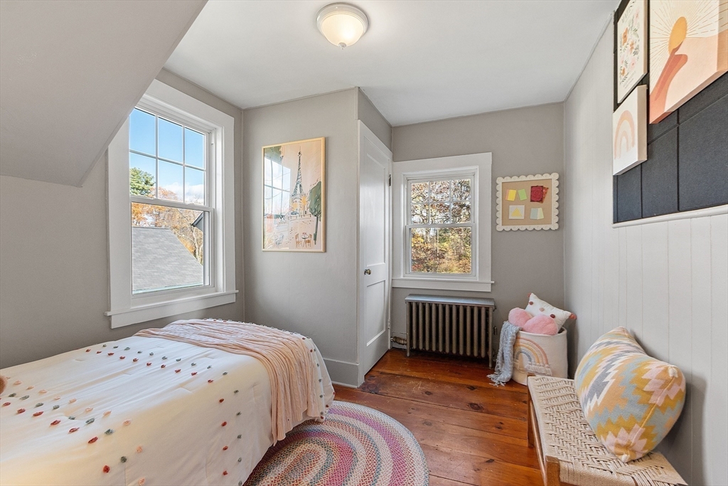 7 Groton-Harvard Road Ayer, MA 01432 - Photo 22 of 35 a bedroom with a bed and wooden floor