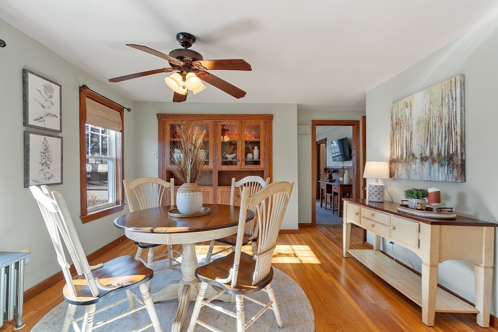 7 Groton-Harvard Road Ayer, MA 01432 - Photo 9 of 35 a dining room with furniture a window and a chandelier
