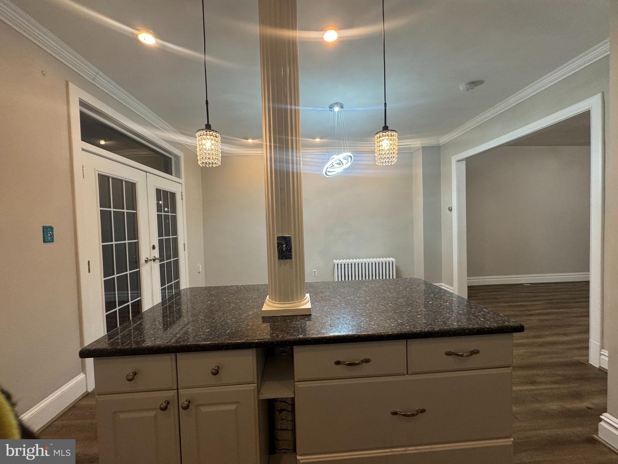 228 Ascot Place Northeast Washington, DC 20002 - Photo 7 of 14 a kitchen with kitchen island a counter space and wooden floor