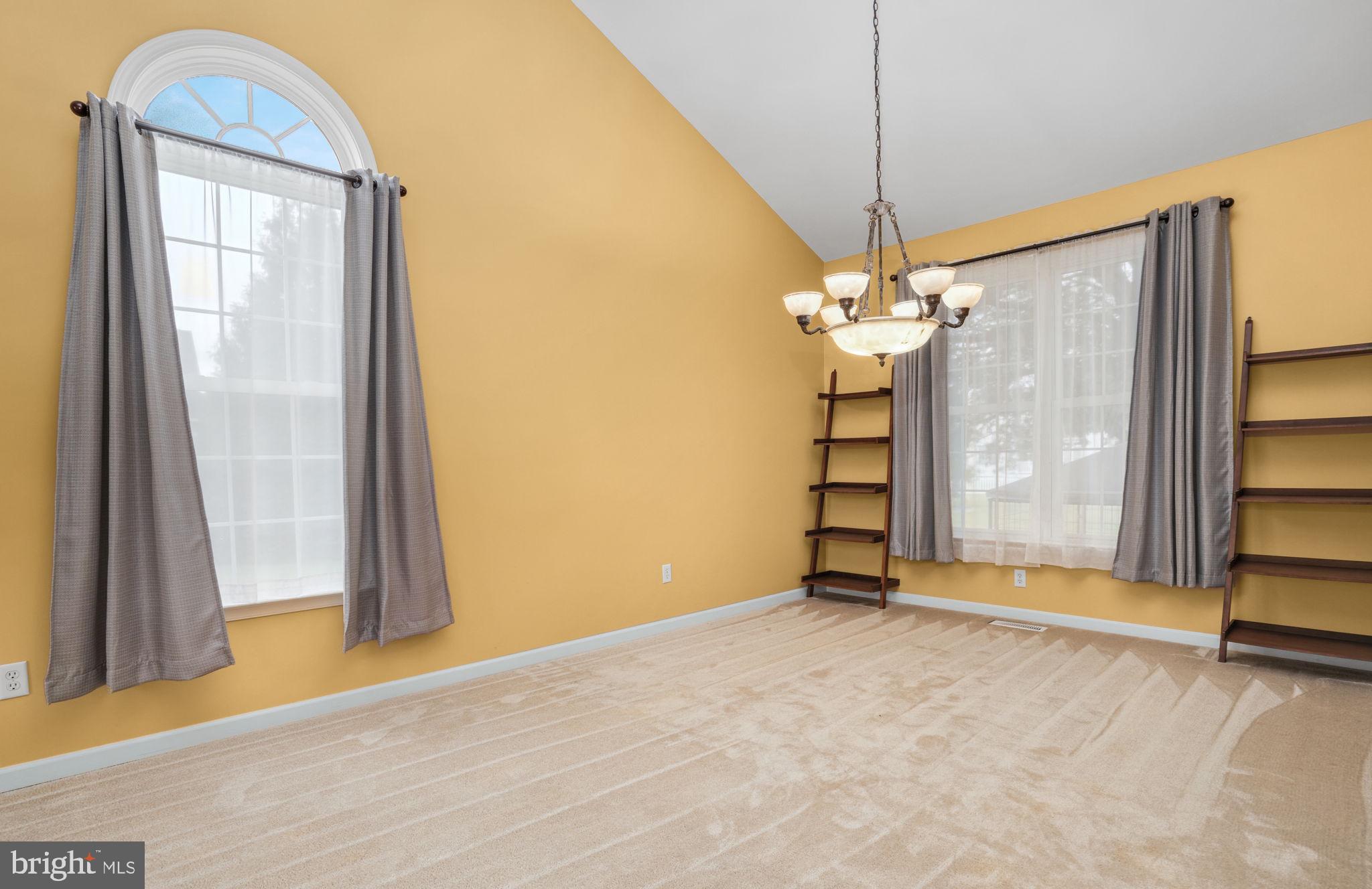 2745 Stockton Road Pocomoke City, MD 21851 - Photo 13 of 57 a view of a room with a chandelier fan and a window