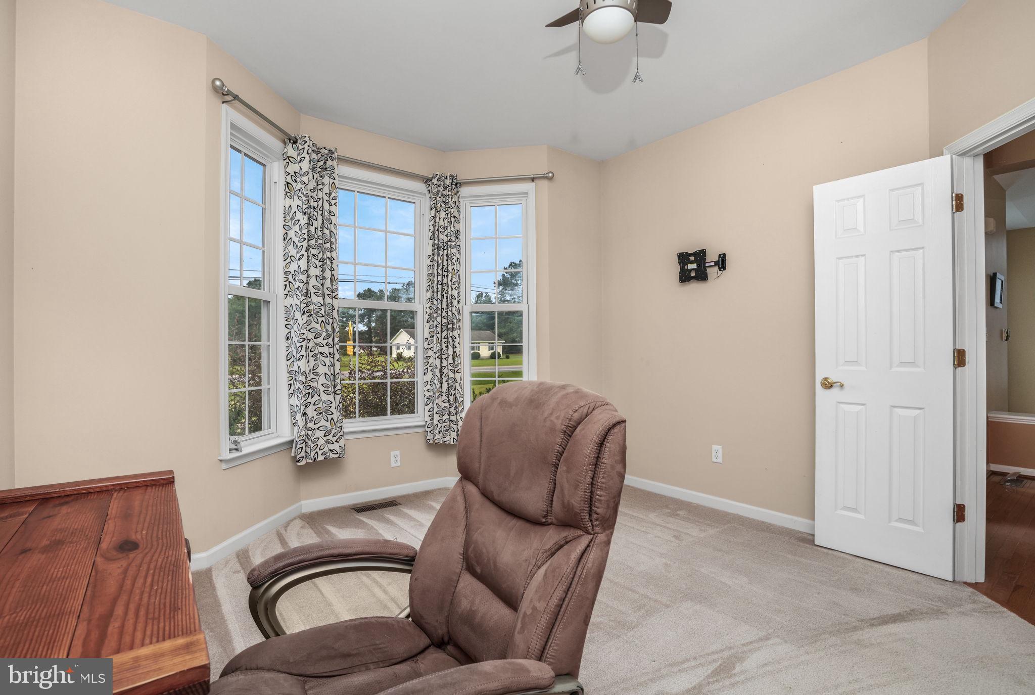 2745 Stockton Road Pocomoke City, MD 21851 - Photo 15 of 57 a living room with furniture and a window