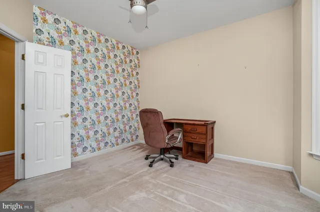 a kitchen with stainless steel appliances a sink a counter top space cabinets and a window