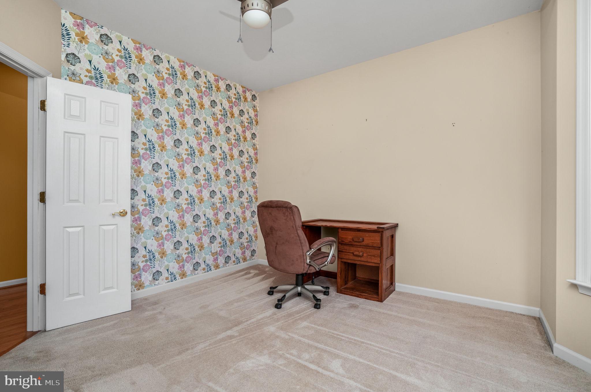 2745 Stockton Road Pocomoke City, MD 21851 - Photo 17 of 57 a view of a workspace with furniture and a chandelier