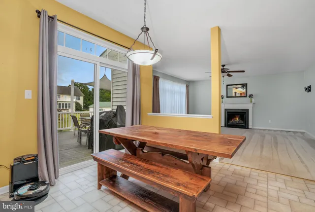 a kitchen with stainless steel appliances kitchen island granite countertop a sink refrigerator and cabinets
