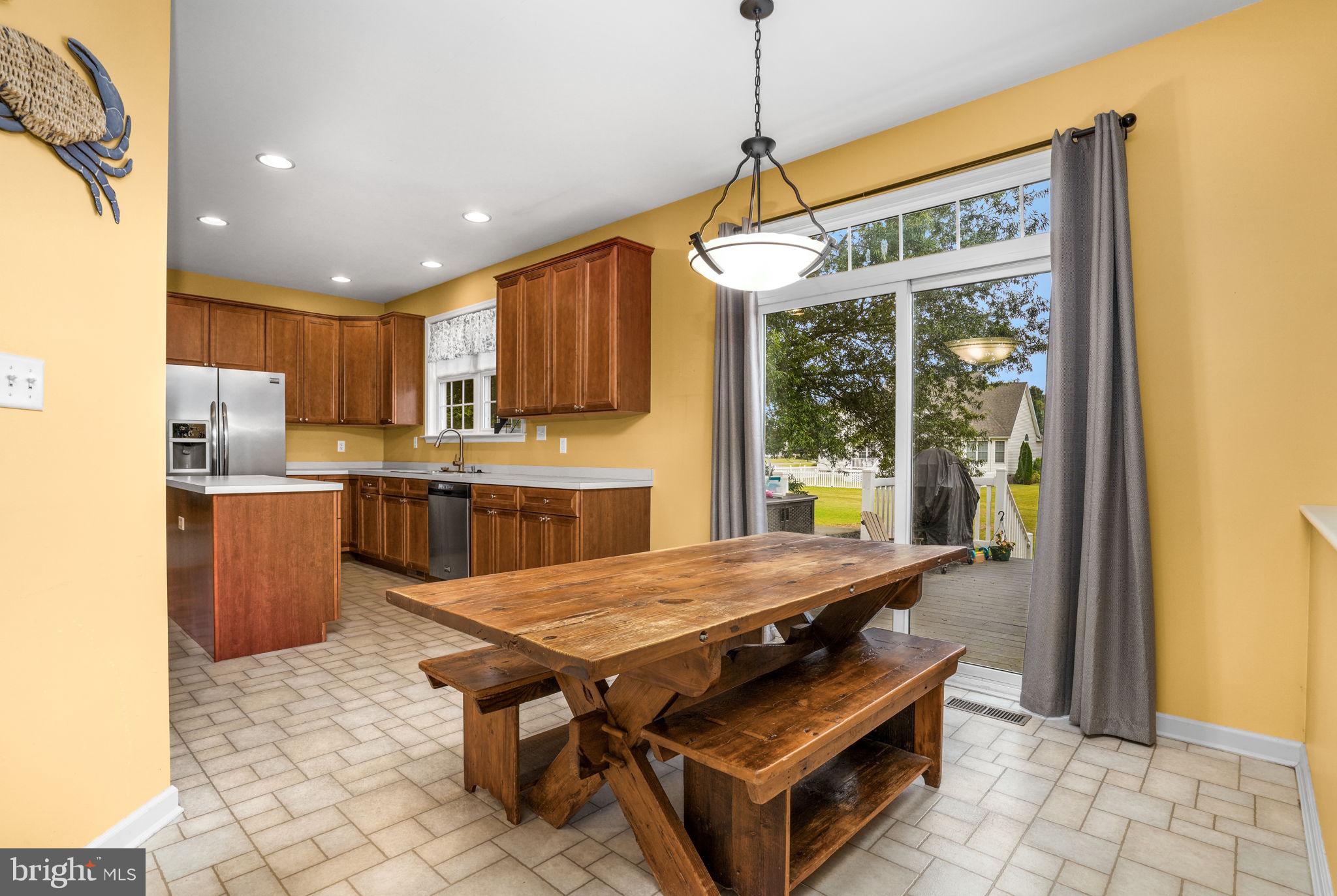 2745 Stockton Road Pocomoke City, MD 21851 - Photo 23 of 57 a outdoor kitchen with a table and chairs
