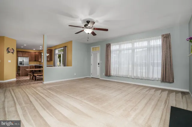 a view of a livingroom with a ceiling fan