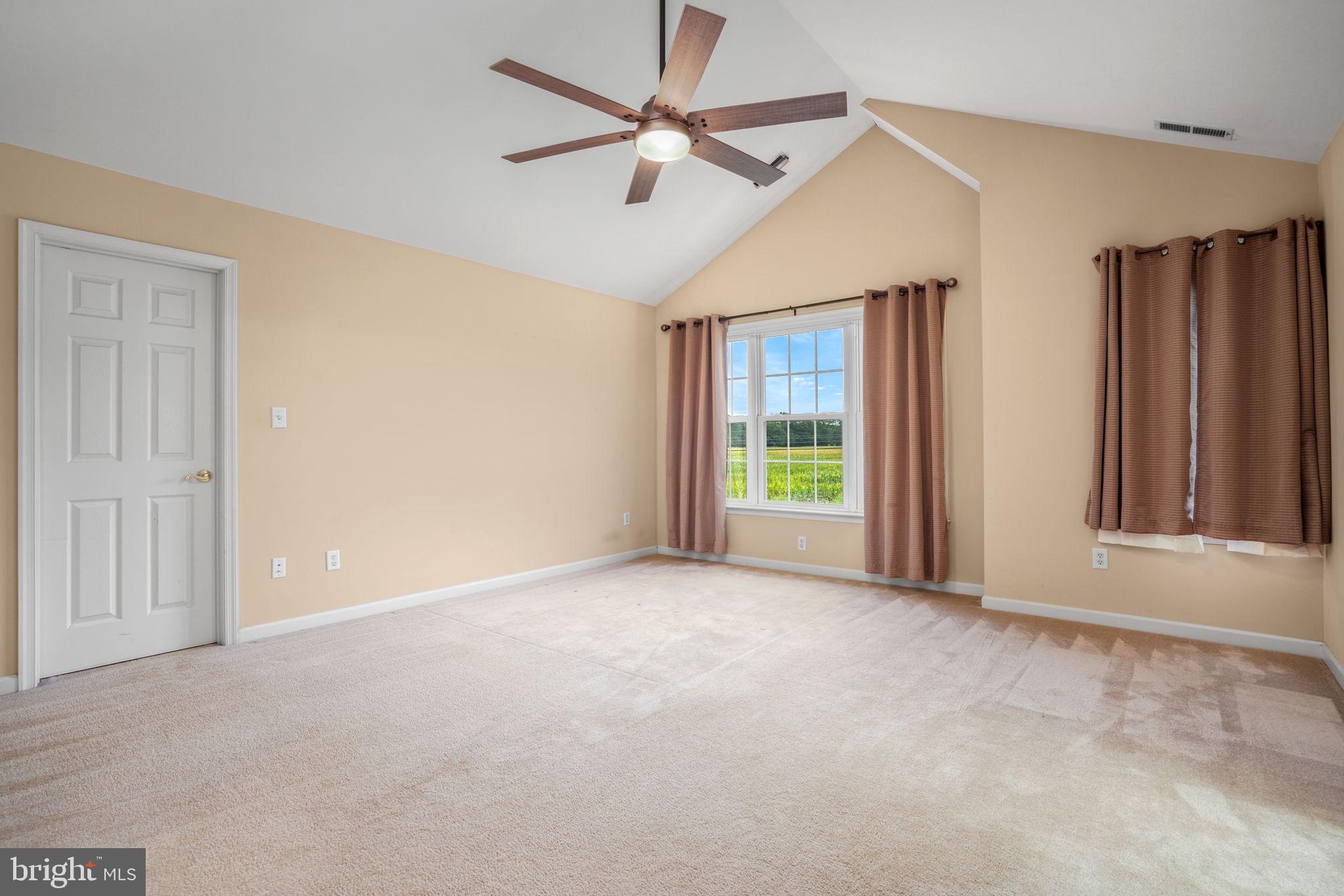 2745 Stockton Road Pocomoke City, MD 21851 - Photo 34 of 57 an empty room with windows and fan