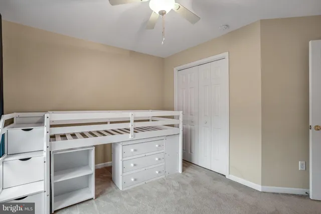 a bed room with a bed and a dresser
