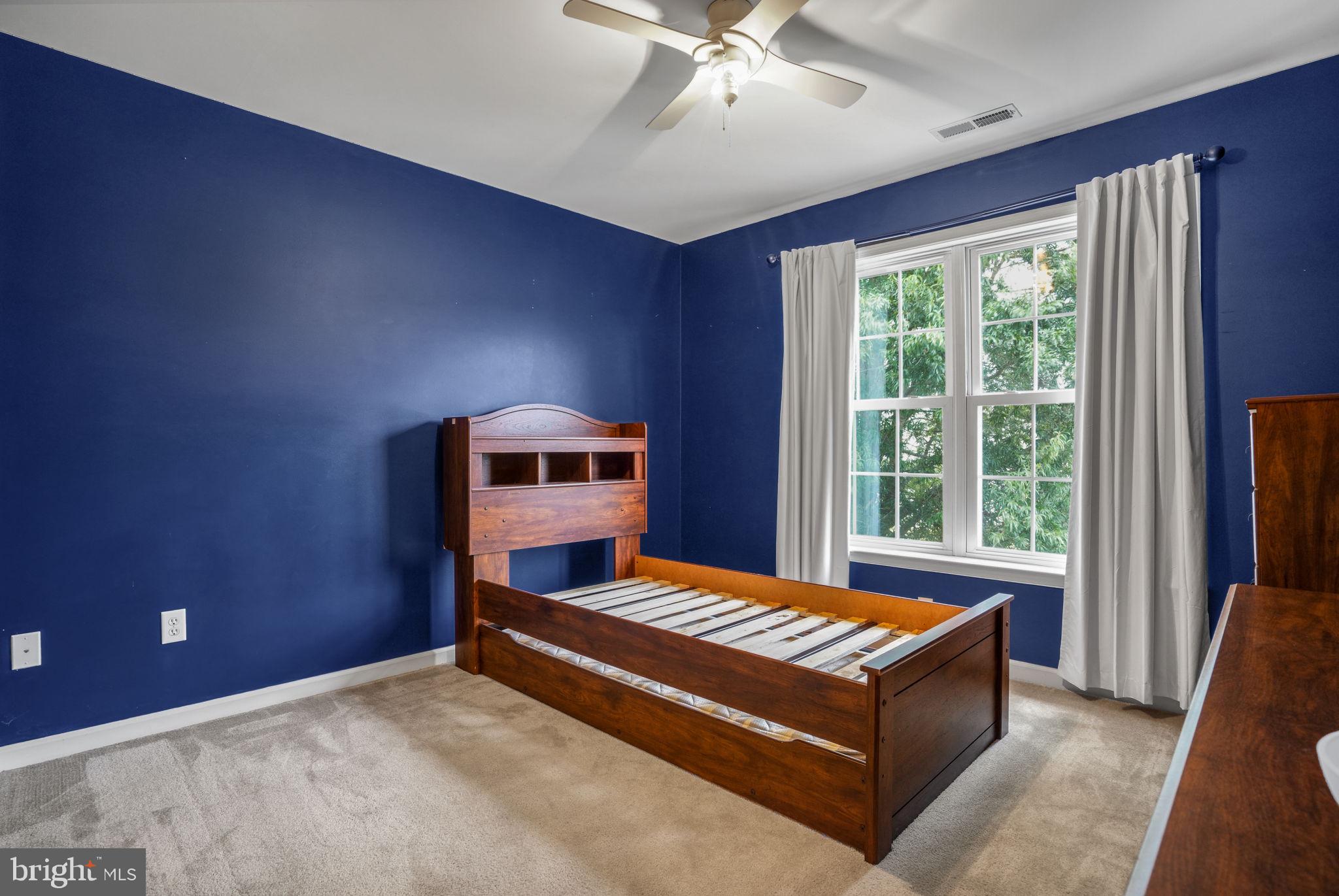 2745 Stockton Road Pocomoke City, MD 21851 - Photo 43 of 57 a living room with a bed furniture and a window