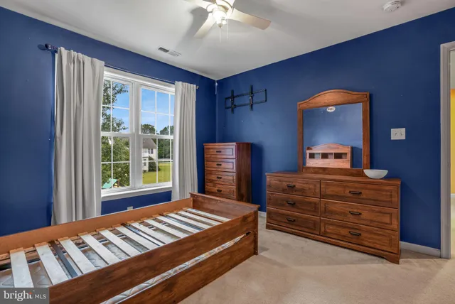 a view of a chairs and table in patio with a barbeque grill