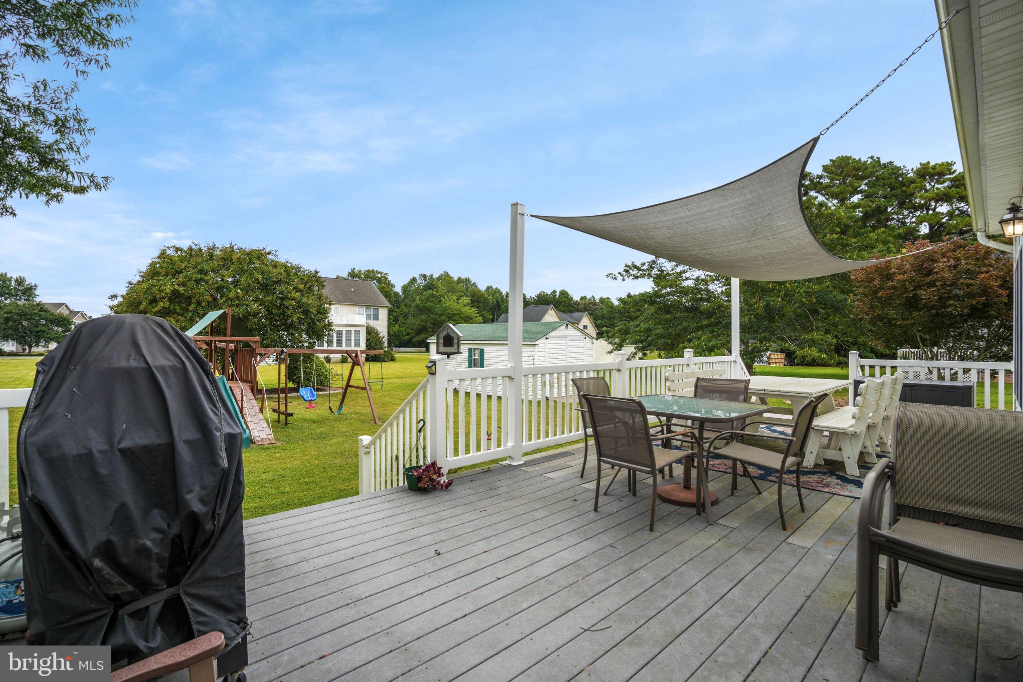 2745 Stockton Road Pocomoke City, MD 21851 - Photo 49 of 57 a view of a chairs and table in patio with a barbeque grill