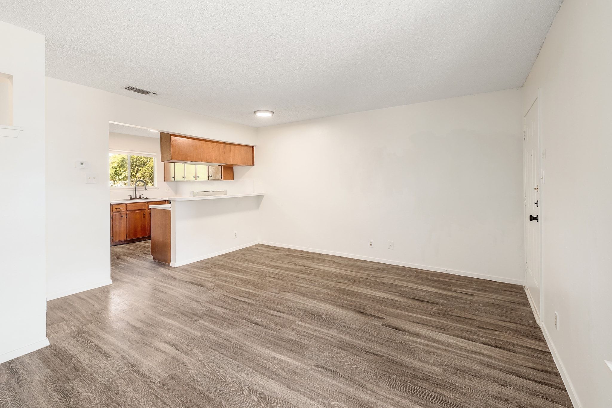 509 Cedar Drive, Unit 206 Georgetown, TX 78628 - Photo 5 of 12 a view of kitchen and wooden floor