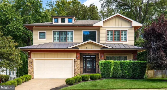 a hallway with a large mirror and a rug