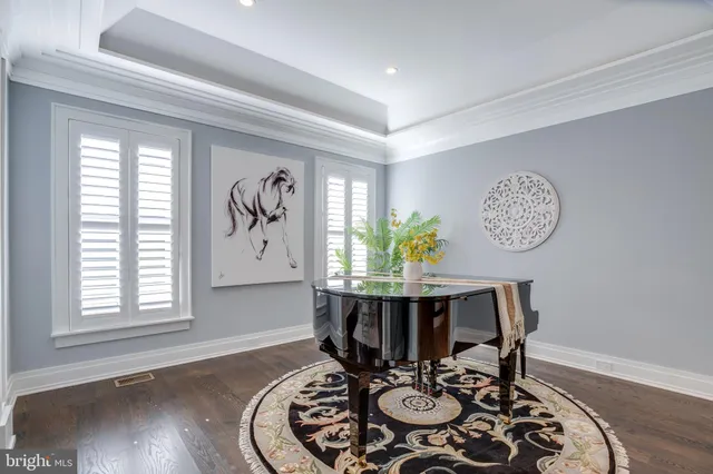 a living room with furniture chandelier and a fireplace